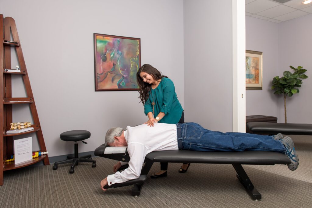 Dr Martha Manzanarez giving her patient a back pain treatment