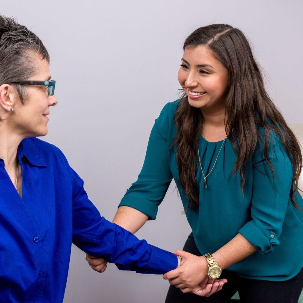 Dr Martha Manzanarez giving her a patient a arm pain treatment
